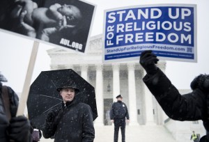 People who support Hobby Lobby's choice to withhold contraceptive healthcare coverage from their employees rally outside the US Supreme Court March 25, 2014 in Washington, DC. (Getty Image).