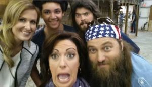 CNN’s Kyra Phillips takes a selfie with the couple behind “Duck Dynasty” before their season 5 finale Wednesday, March 26, 2014.