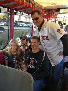 Adrianne Haslet-Davis & Adam Davis hold the World Series trophy, with Red Sox manager John Farrell, as part of the parade to celebrate the World Series victory. SOURCE: Adrianne Haslet-Davis/Adam Davis